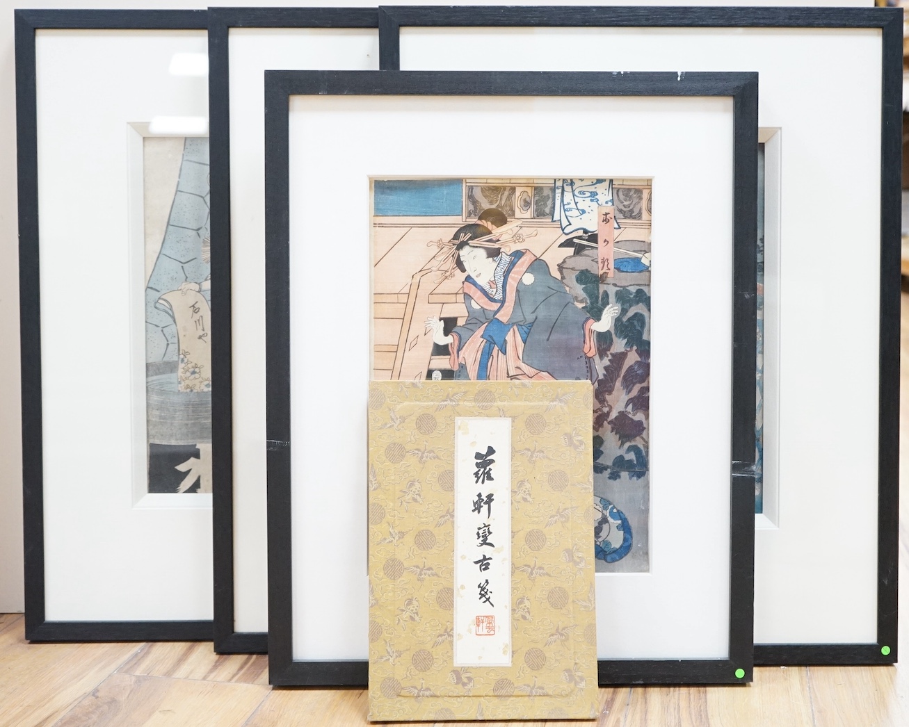 Four Japanese woodblock prints, to include: after Toyokuni - kabuki actors together with a Chinese printed booklet, largest 35 x 23cm. Condition - good